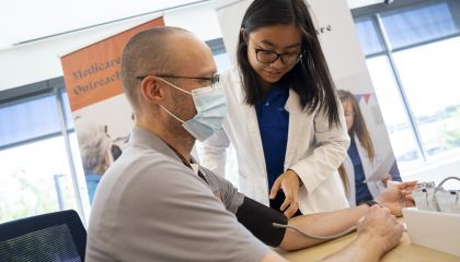 PharmD student taking a patient's blood pressure