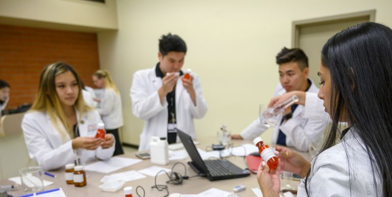 PharmD students participating in a compounding lab