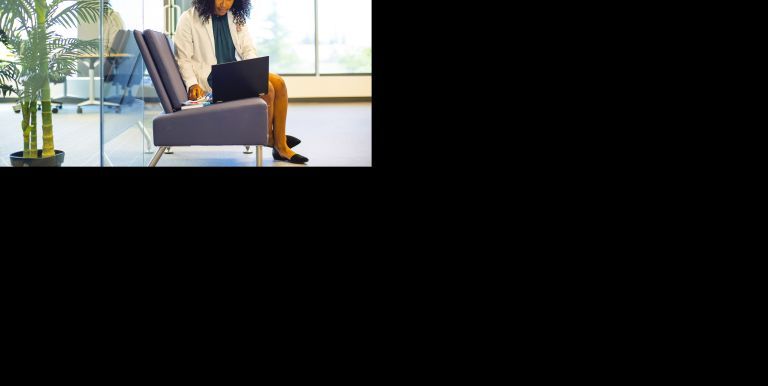 PharmD student with laptop outside quiet study area