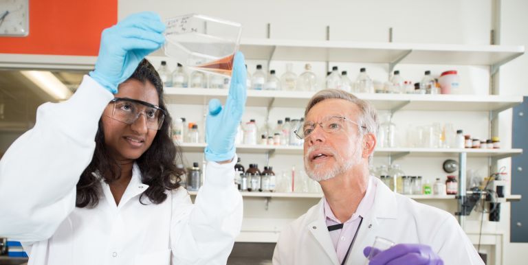 John Livsey with student in research lab