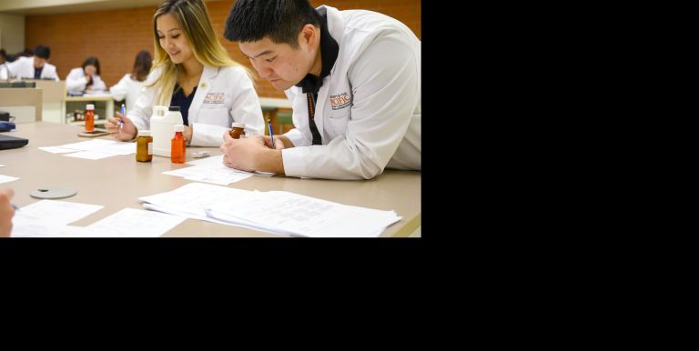 pharmacy students in compounding lab