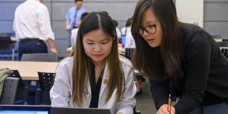 Yvonne Mai with PharmD student in ambulatory care course