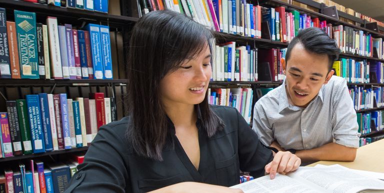 Two students in library
