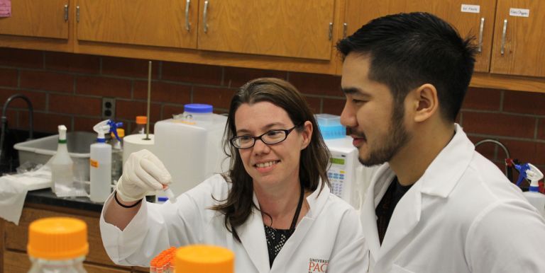 pharmacy faculty with student in lab