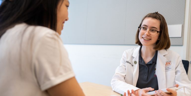 doctor of pharmacy student with patient