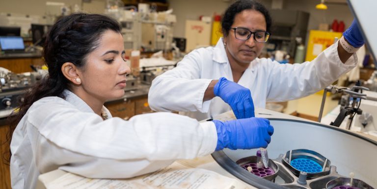 Two students in research lab