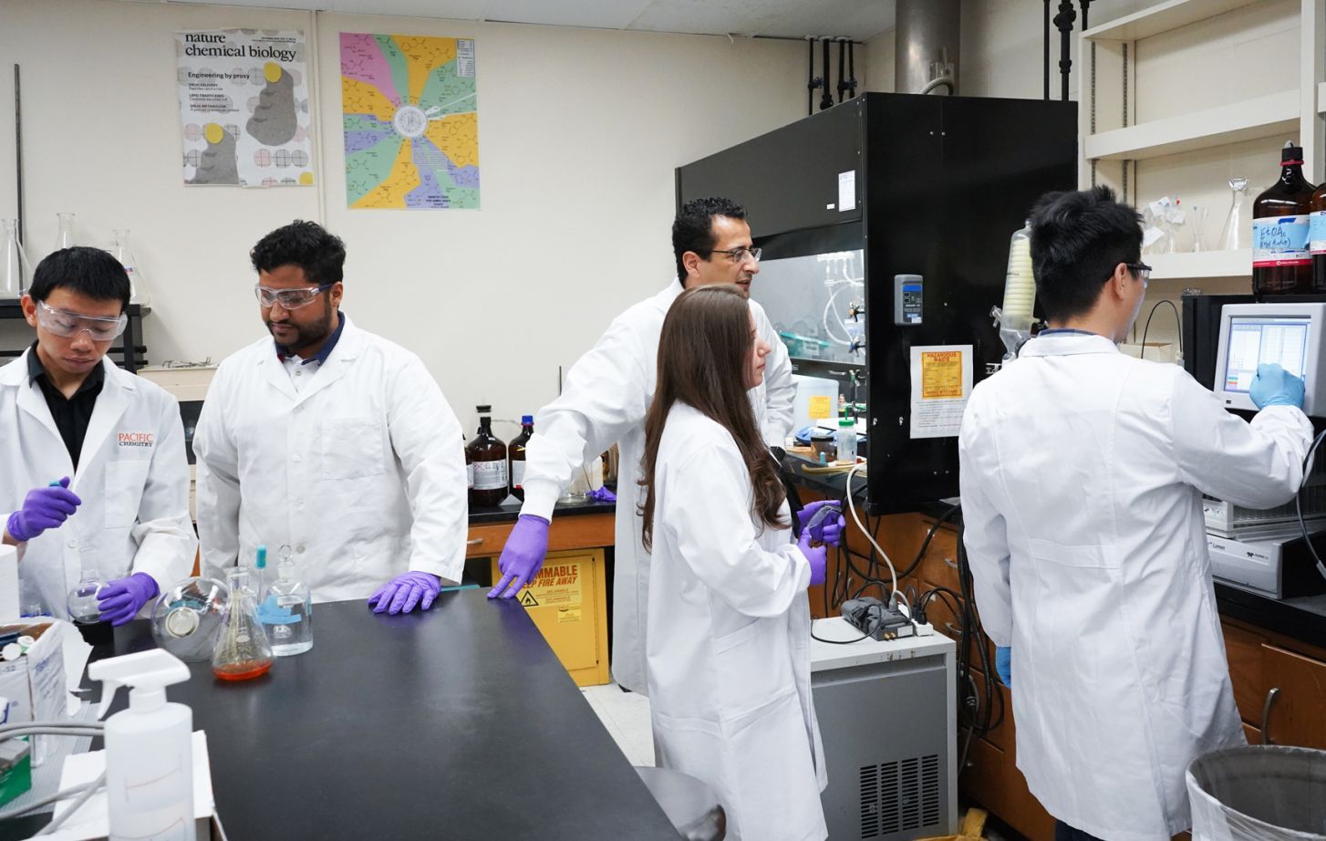 Professor Alhamadsheh and research assistants in the lab