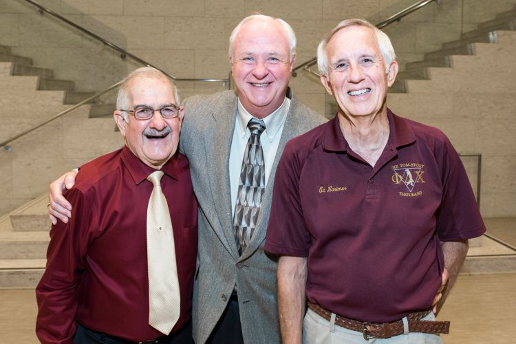 Three PharmD Alumni posing in DUC.