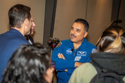 Jose Hernandez talks with attendees at a movie screening