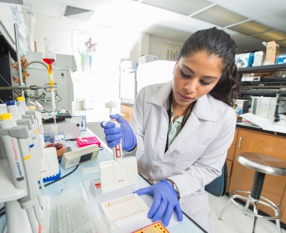 Female research assistant in lab