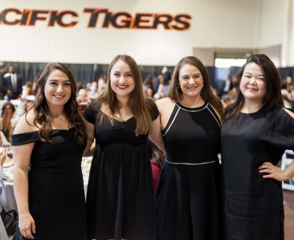 Four PharmD graduates at the annual Pharmacy Graduation Banquet