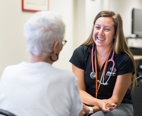 Doctor of physical therapy with patient at clinic in Stockton