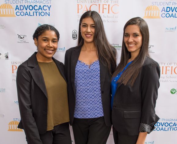 Three PharmD students at the Legislative Dinner event