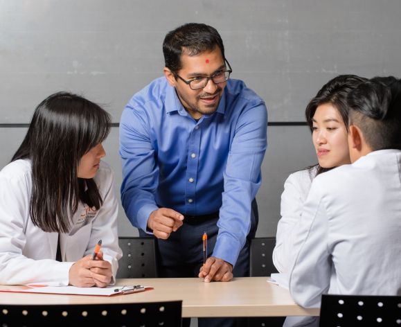 pharmacy students with faculty in classroom