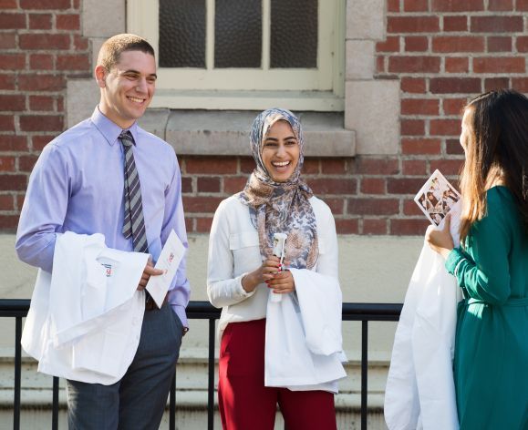 Three PharmD students at White Coat Ceremony