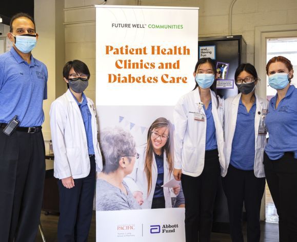 Pharmacy students and faculty members at Abbott Fund’s Future Well health care clinic