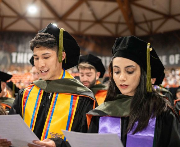 PharmD graduates recite the Oath of a Pharmacist
