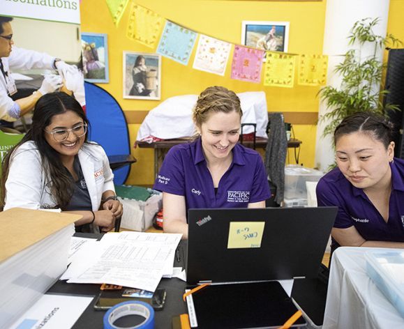 Carly Ranson with PharmD students at a Medicare Part D Outreach Clinic