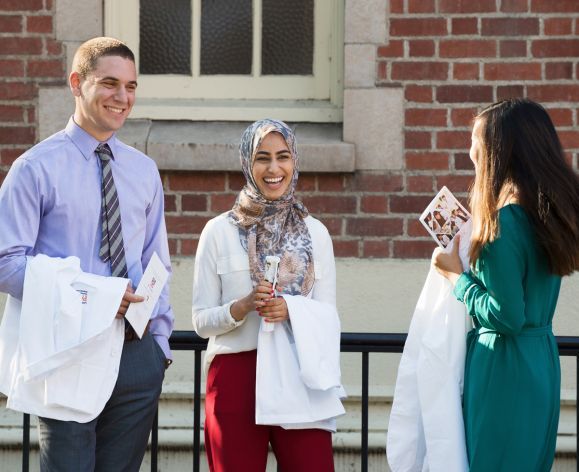 Three PharmD students at White Coat Ceremony